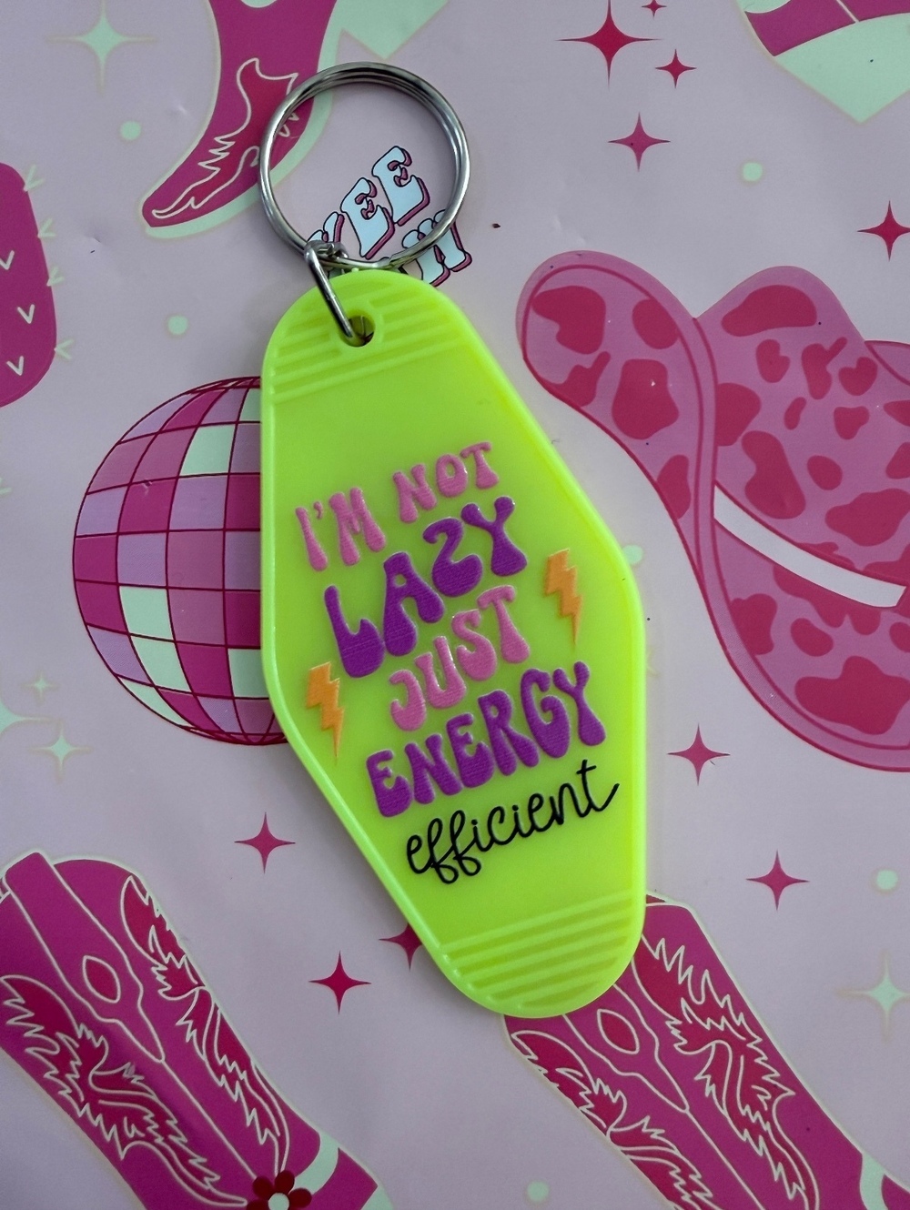 Yellow Keychain with 'I'm Not Lazy Just Energy Efficient' Text